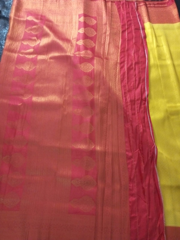 Yellow with red semi silk saree with golden self design