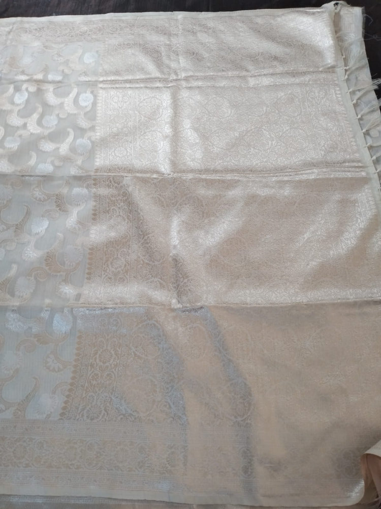 Off white with golden jaal self design semi silk saree