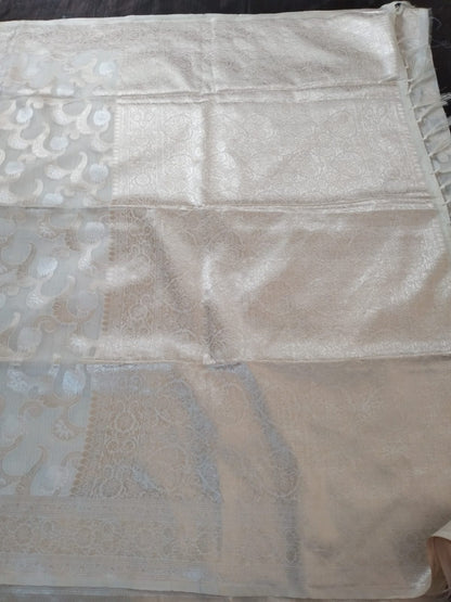 Off white with golden jaal self design semi silk saree