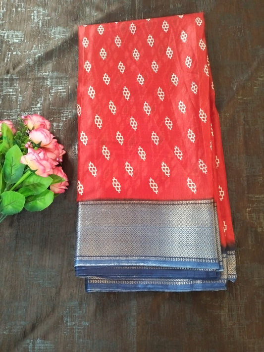 Red geometric design semi silk saree with rich blue border