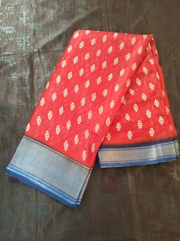 Red geometric design semi silk saree with rich blue border