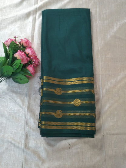Bottle green colour with Golden line border Mysore Semi Crepe silk saree