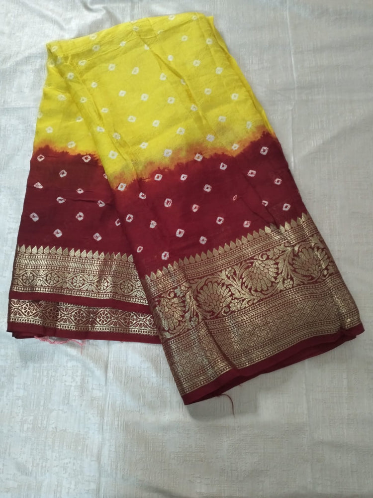Yellow with Red bandhani soft silk with heavy golden border
