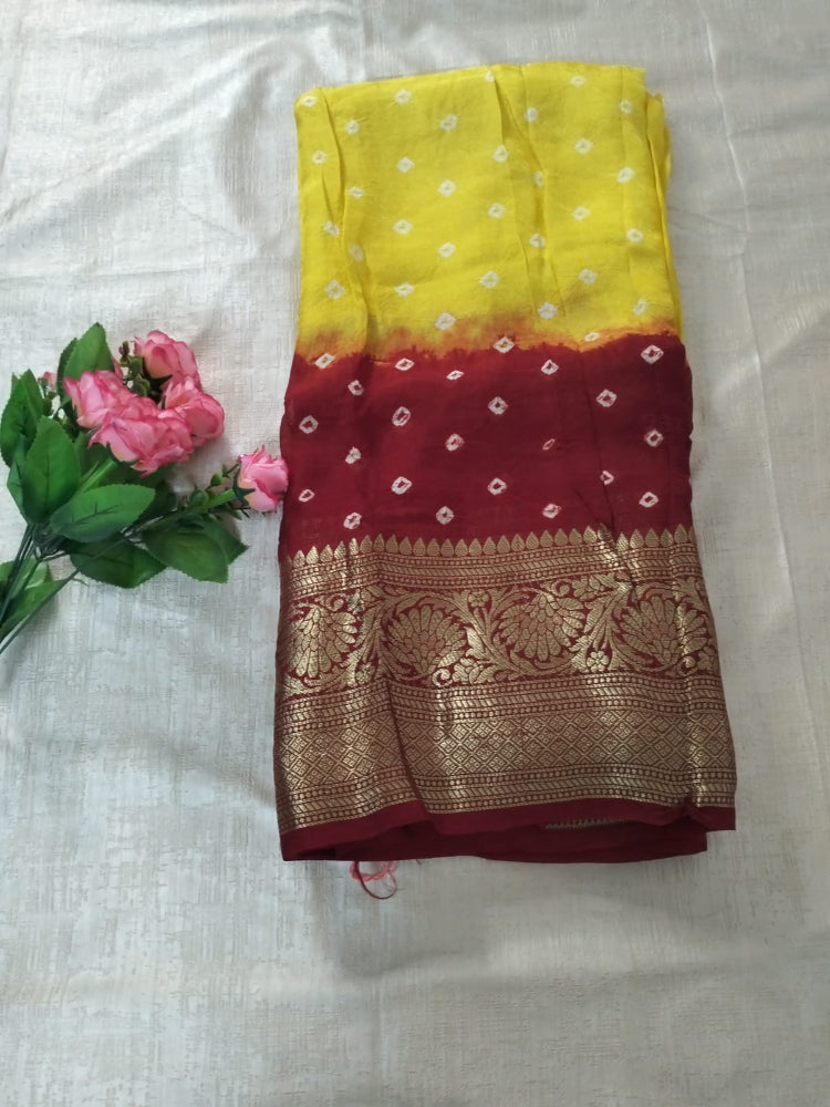 Yellow with Red bandhani soft silk with heavy golden border