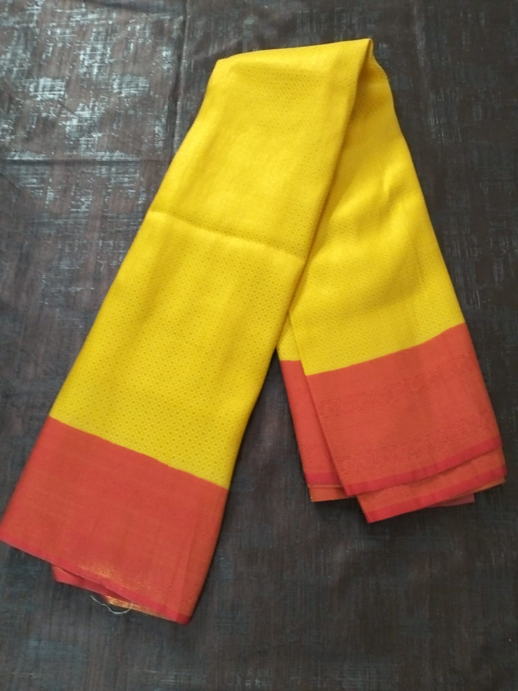 Yellow with red semi silk saree with golden self design