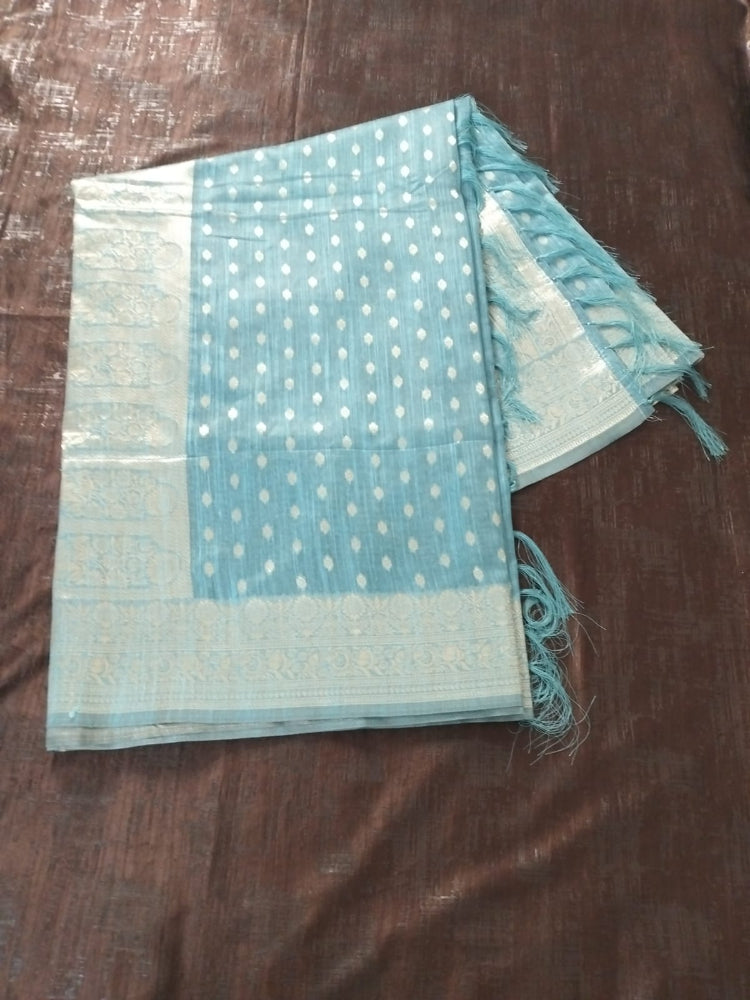 Blue with silver buties and heavy border semi silk saree