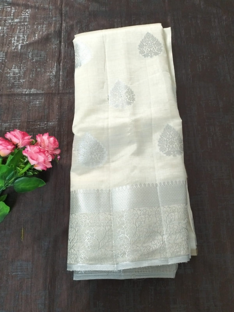 White semi benarasi silk with silver base pallu and big buttas