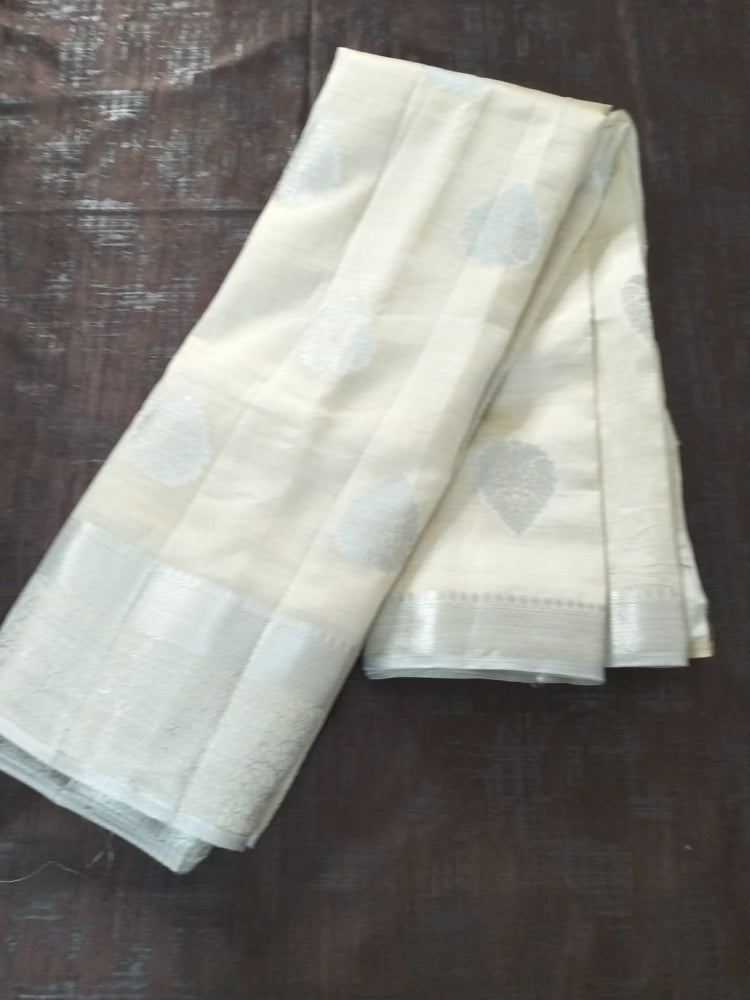 White semi benarasi silk with silver base pallu and big buttas
