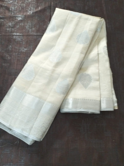 White semi benarasi silk with silver base pallu and big buttas