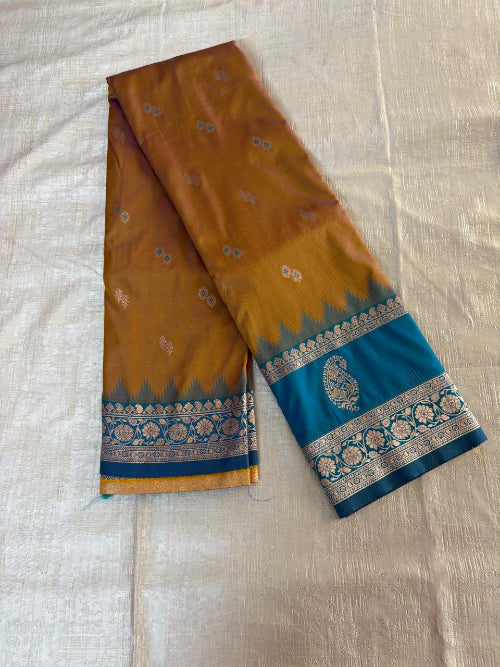 Mustard colur with blue base heavy double border semi silk saree