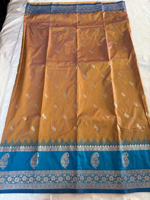 Mustard colur with blue base heavy double border semi silk saree