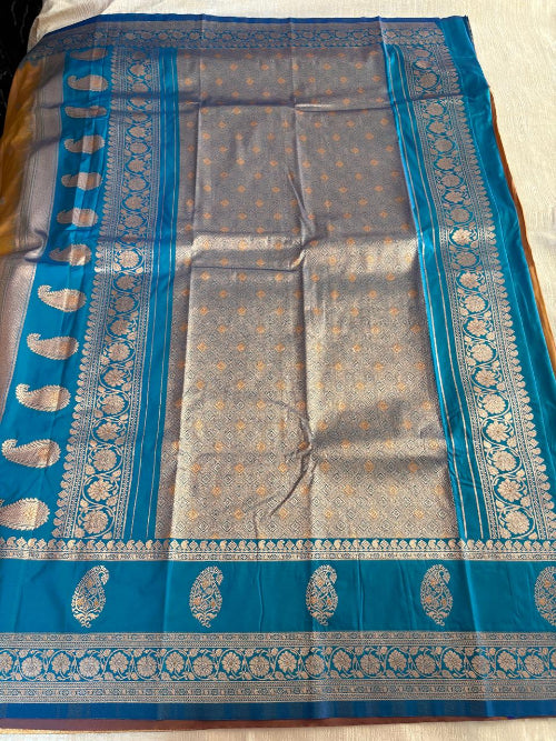 Mustard colur with blue base heavy double border semi silk saree