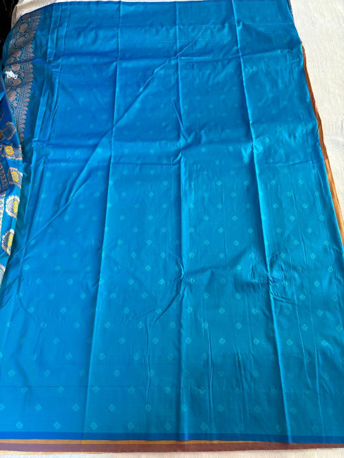 Mustard colur with blue base heavy double border semi silk saree
