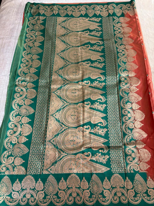 Rust with Green base heavy border semi silk saree