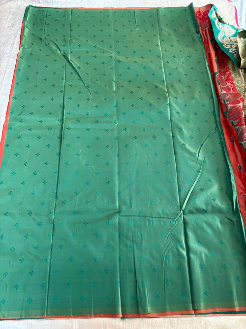 Rust with Green base heavy border semi silk saree