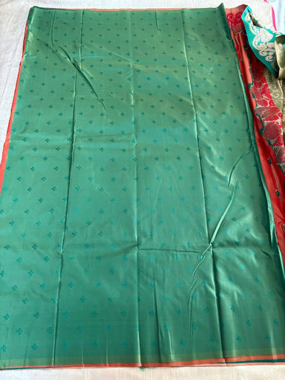 Rust with Green base heavy border semi silk saree